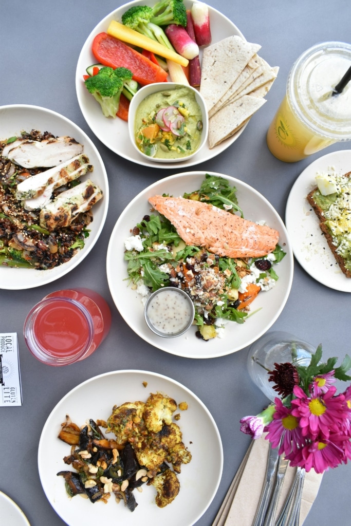 Table full of food on white plates