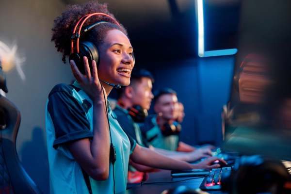 girl wearing headset playing esports